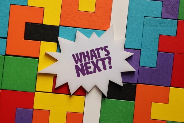 Expression What's next? overlaying multi-colored blocks